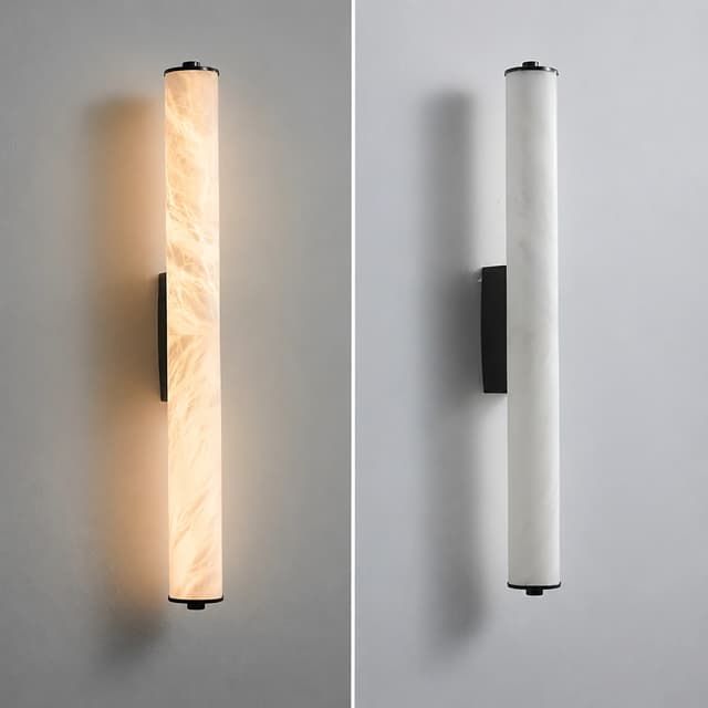 Black vertical cylinder wall sconce shown in illuminated and unlit views