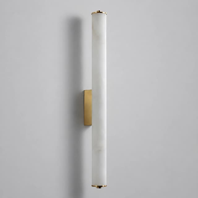 Unlit vertical cylinder wall sconce with white stone look diffuser and brass finish