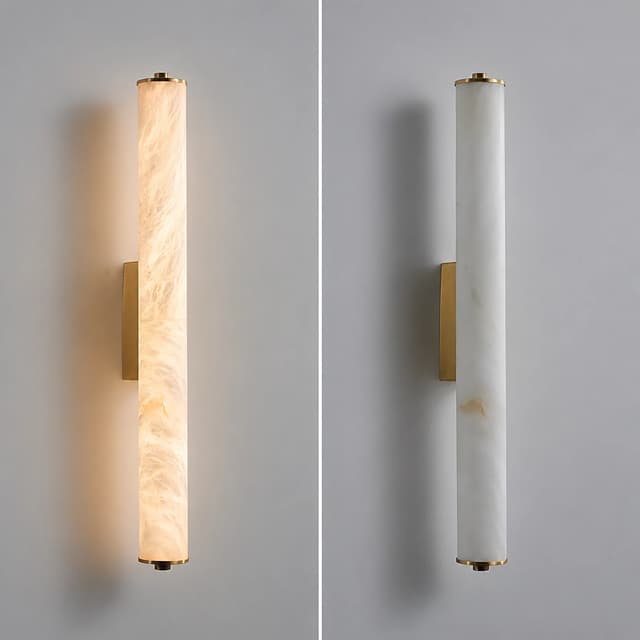 Brass cylinder wall sconce shown illuminated and unlit with translucent stone texture