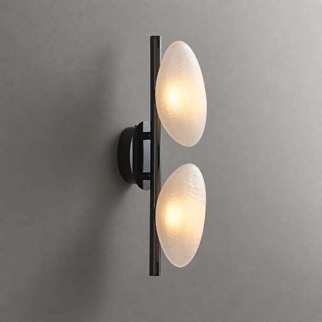 Two light frosted organic glass wall sconce with black vertical frame and soft diffused glow