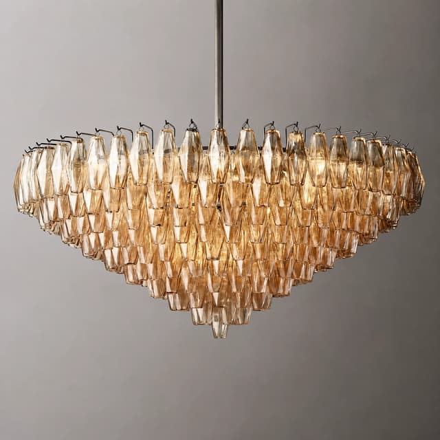Tiered amber glass cascade chandelier with dark metal downrod and sculptural bowl shaped silhouette
