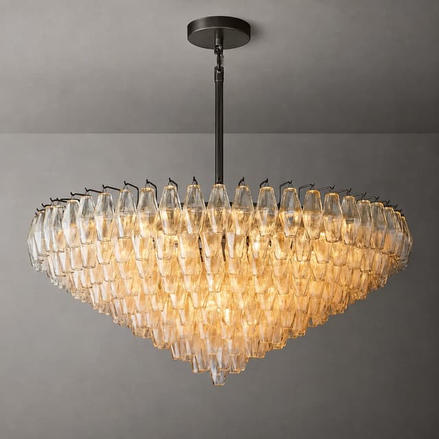 Illuminated amber glass waterfall chandelier with dark ceiling canopy and multilayer cascading