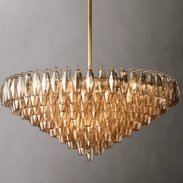 Front view of amber textured glass chandelier with layered waterfall tiers and slim gold tone
