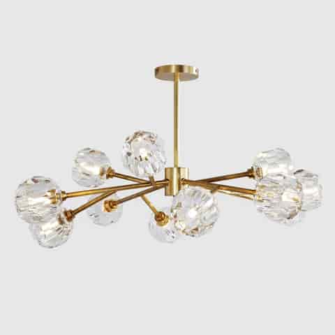 Modern gold branch chandelier with asymmetrical arms and faceted clear globe shades