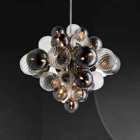 Close up of sculptural glass globe cluster chandelier with smoked, clear and spiral ribbed glass spheres