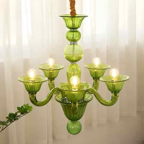 Vintage inspired green glass chandelier installed in a residential interior
