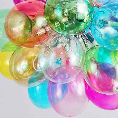 Close up of colorful bubble globe chandelier with translucent pink, green, blue and amber spheres