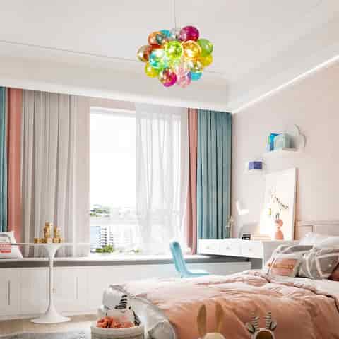Multicolor bubble globe pendant light in a bright modern bedroom with pastel decor