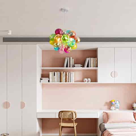 Colorful bubble chandelier installed in a modern pink bedroom and study area