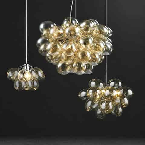 Bubble globe cluster chandeliers in multiple sizes with warm amber transparent spheres