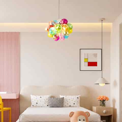 Colorful globe cluster chandelier above a modern bedroom with playful pastel interior