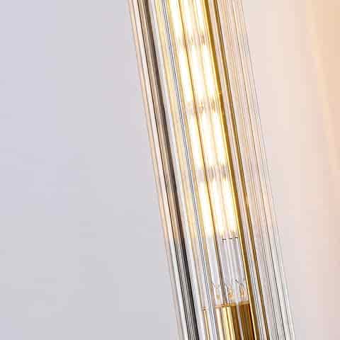 Close up of clear fluted glass shade on a copper wall sconce