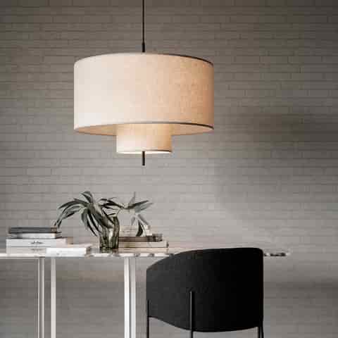 Double drum linen pendant light above a modern home office desk with soft diffused lighting