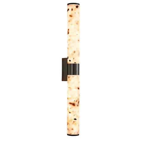Vertical blackened brass terrazzo LED wall sconce on white background