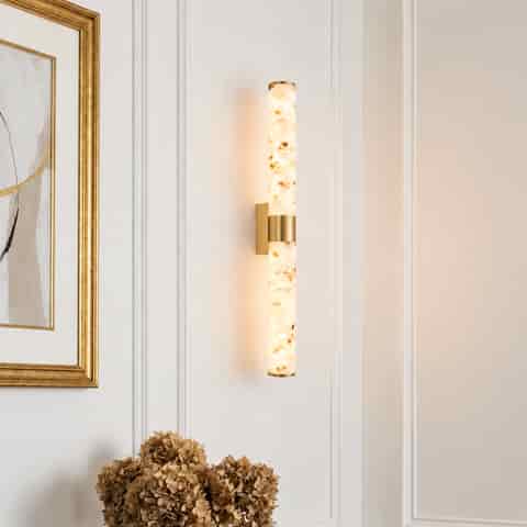 Long natural brass and terrazzo LED wall sconce in an elegant interior