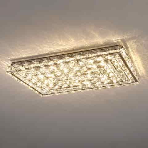 Square crystal flush mount ceiling light viewed from below with layered geometric faceted panels